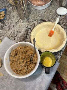 Filling and egg washed bottom crust for Tourtiere